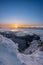 Snow covered landscape sunrise sun from Velky Choc mountain in winter, with view of low and high Tatras and Liptovska Mara, slovak