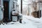 snow-covered mailbox next to a blocked door