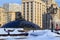 Snow-covered Manege square and World Clock Fountain on the background of State Duma of Russian Federation building. Winter in Mosc