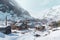 snow-covered mining camp in a remote mountainous area