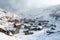 snow-covered mining camp in a remote mountainous area