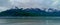 Snow covered mountain and cloudy sky Floating ice in clod water, a view from Alaska ,