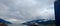 Snow covered mountain  and cruise ship approaching to the  port in Alaska 