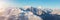 Snow covered Mountain Peak. Canadian Nature Aerial Background Panorama.