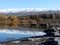 Snow covered mountain range reflected in lake at Butcher\'s Dam, Central Otago, New Zealand