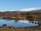 Snow covered mountain range reflected in lake at Butcher\'s Dam, Central Otago, New Zealand