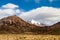 Snow covered mountain soaring from altiplano in Boliv