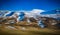 Snow covered mountains and Countyside with red roofed farmhouse in Iceland