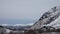 Snow covered mountains and fjord near Austerstraumen bru in winter in Norway