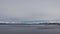 Snow covered mountains and ocean from Hinnoya near Holdoya in winter in Norway