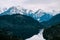 Snow-covered mountains over Alpsee is a lake in Ostallgau district of Bavaria, Germany, located about 4 kilometres