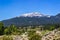 Snow Covered Mountains Overlooking Meadow