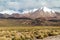 Snow covered mountains soaring from altiplano in Boliv