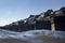 Snow covered ocean protection wall in Scheveningen harbour water view