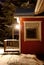 Snow-covered porch of the house and night lantern