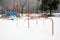 Snow covered public children playground at winter time