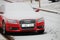 Snow-covered red Audi