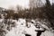 A snow covered river in Vail, Colorado during winter.