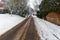 Snow covered road through