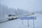 Snow covered road in Finnish Lapland, it's still snowing