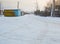 Snow-covered road in the garage in the winter