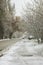 Snow covered road in winter. Winter in the city. Snowy street in winter. Cars on the slippery road. Frozen town. Drive in winter.