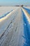 Snow covered road in winterlandscape