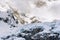 Snow covered rocks high in the mountains create a perfect alpine landscape