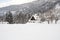 Snow covered roofed house Gassho-zukuri in Ainokura village, Gifu, Japan.