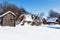 snow-covered ruined courtyard in village in winter