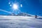 Snow-Covered Ski Slope and Ski Lift and Bright Sun