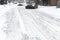 Snow-covered slippery road after snow blizzard