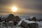 Snow covered stack round bales of hay in a farmers field