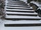 Snow covered stair steps without handrails for pedestrians