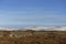 The Snow covered Tops of the Angus Glens above the stone embanked Ramparts of the White Caterthun Iron Age Hill Fort.