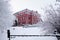 Snow-covered trees around the Khabarovsk Museum of Local Lore after heavy snowfall in the morning at sunrise. Trees in