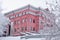 Snow-covered trees around the Khabarovsk Museum of Local Lore after heavy snowfall in the morning at sunrise. Trees in