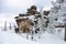 Snow-covered trees and mountain skiing on top of mountain, active winter relaxation