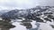 Snow covered valley with lakes in the lower part as seen from the air