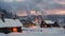 a snow-covered village with numerous stacks emitting smoke, creating a captivating scene, A quiet snowy village, glowing windows,