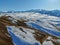 Snow-covered winter pasture in the mountains in winter