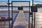 Snow covered wooden jetty at a frozen lake on a sunny day in germany