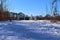 Snow covered wooden jetty at a frozen lake on a sunny day in germany