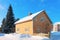 Snow covered yellow Cottage house at winter Rovaniemi