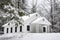 Snow covers a little white church in the Smoky Mountains.