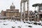 Snow covers the streets of Rome, Italy. Forum of Ciulio Cesare.