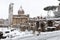 Snow covers the streets of Rome, Italy. Forum of Ciulio Cesare.