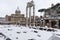 Snow covers the streets of Rome, Italy. Forum of Julius Caesar