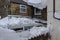 Snow damage to a conservatory roof and guttering.