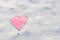 Snow with drown pink heart shape.